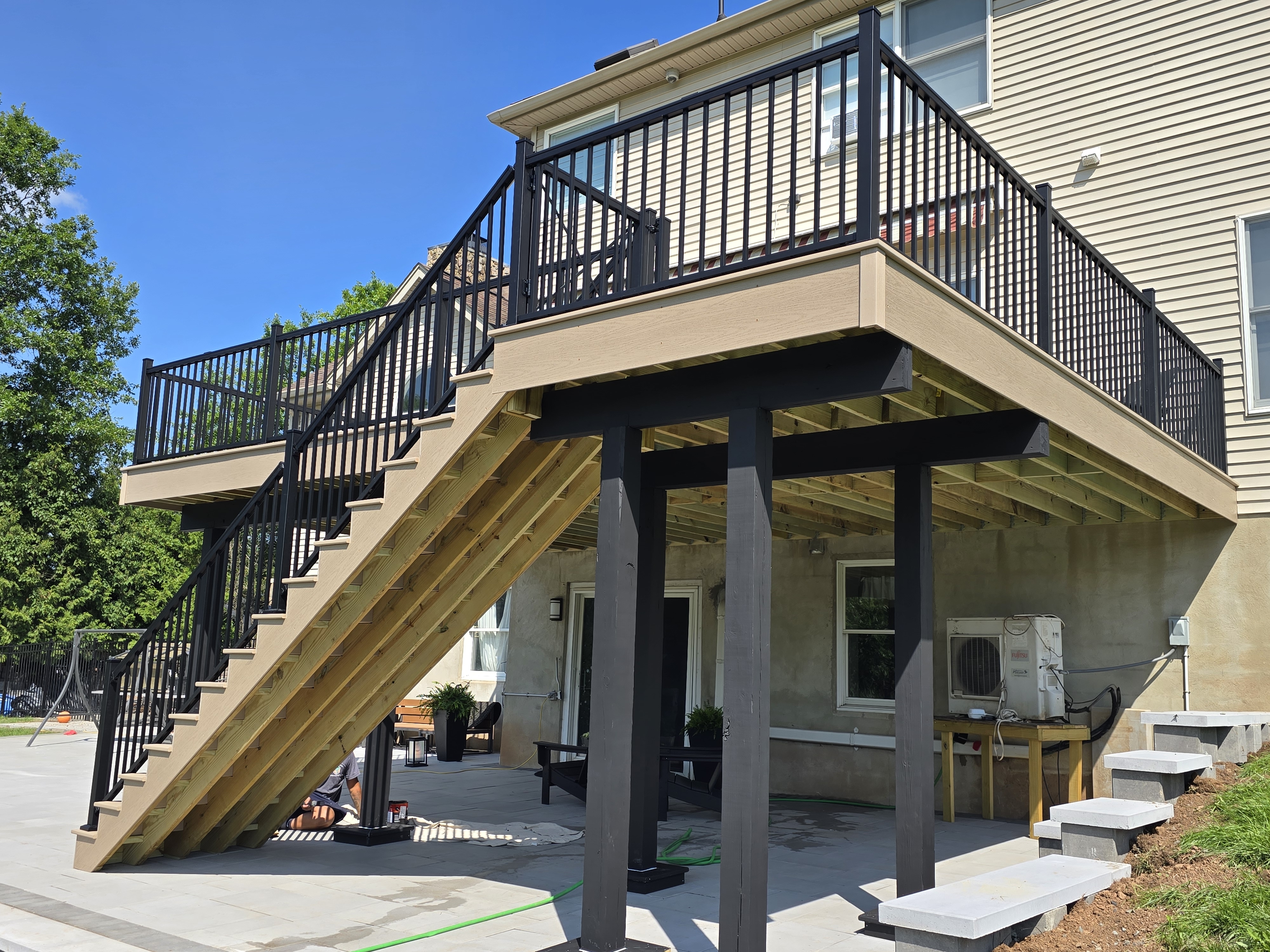 Painted pressure-treated framing below an elevated PVC deck in Bridgewater New Jersey