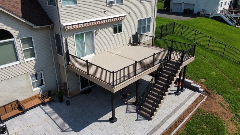 Large low-maintenance WOLF PVC deck with black aluminum railings in Bridgewater New Jersey